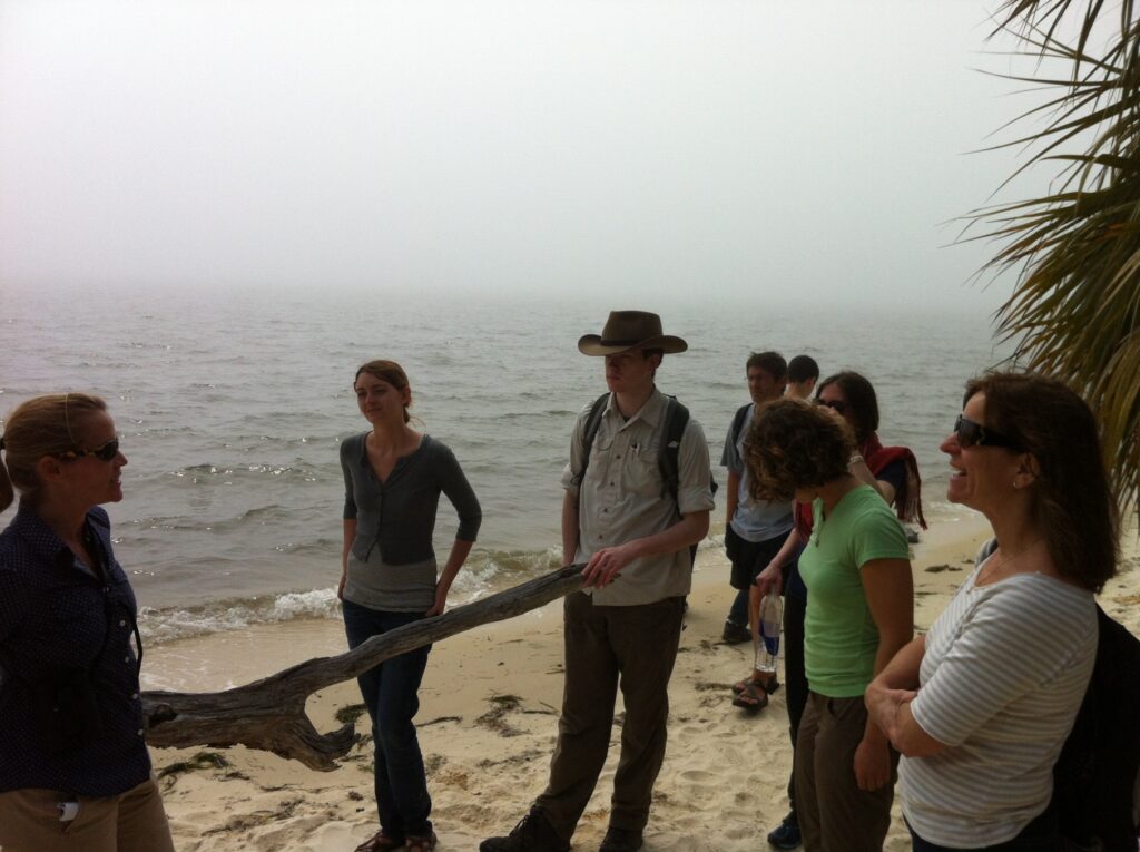 A group of faculty and students on the coast of Cedar Key. 